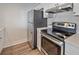 Stainless steel appliances and white cabinets in this updated kitchen at 2807 W 52Nd Ter, Bradenton, FL 34207