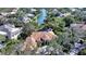 Aerial view of luxury home community with lake and lush landscaping at 282 Shell Midden Ct, Osprey, FL 34229