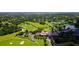 Aerial view of golf course and community with clubhouse at 282 Shell Midden Ct, Osprey, FL 34229