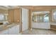 Large bathroom with marble vanity and tiled floors at 282 Shell Midden Ct, Osprey, FL 34229