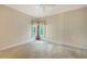 Well-lit bedroom with corner windows and neutral carpeting at 282 Shell Midden Ct, Osprey, FL 34229