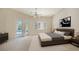 Serene bedroom with pool access and ample natural light at 282 Shell Midden Ct, Osprey, FL 34229