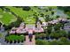 Aerial view of clubhouse with golf course and landscaping at 282 Shell Midden Ct, Osprey, FL 34229