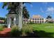 Landscaped view of the clubhouse from the golf course at 282 Shell Midden Ct, Osprey, FL 34229