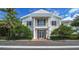 Community building with columns and balcony; welcoming entrance at 282 Shell Midden Ct, Osprey, FL 34229