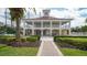 Elegant community clubhouse with tennis courts and pool nearby at 282 Shell Midden Ct, Osprey, FL 34229