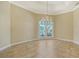 Formal dining room featuring a large window and a stunning chandelier at 282 Shell Midden Ct, Osprey, FL 34229