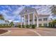 Grand entrance with columns and landscaping at 282 Shell Midden Ct, Osprey, FL 34229