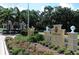 The Oaks Club guard house and entrance with landscaping at 282 Shell Midden Ct, Osprey, FL 34229