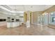 Spacious kitchen with island, white cabinets, and granite countertops at 282 Shell Midden Ct, Osprey, FL 34229