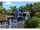 playground with swings and slide, enclosed by a fence at 282 Shell Midden Ct, Osprey, FL 34229