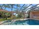 Relaxing pool and patio with water view at 282 Shell Midden Ct, Osprey, FL 34229