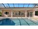 Inviting pool and spa with covered patio and lush landscaping at 282 Shell Midden Ct, Osprey, FL 34229