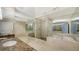 Luxurious bathroom features a large soaking tub, walk-in shower, and marble finishes at 3010 Grand Bay Blvd # 493, Longboat Key, FL 34228