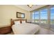 Comfortable bedroom with a king-size bed and access to a private balcony at 3010 Grand Bay Blvd # 493, Longboat Key, FL 34228