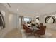 Elegant dining room features a dark wood table with six brown chairs and stunning artwork at 3010 Grand Bay Blvd # 493, Longboat Key, FL 34228