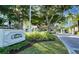 Grand entrance to Grand Bay community with lush landscaping at 3010 Grand Bay Blvd # 493, Longboat Key, FL 34228