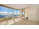 Bright living room showcases stunning water views and access to a balcony at 3010 Grand Bay Blvd # 493, Longboat Key, FL 34228