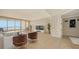 Spacious living room with water views and access to balcony at 3010 Grand Bay Blvd # 493, Longboat Key, FL 34228