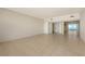 Spacious living room with tile floors and doors to balcony at 3010 Grand Bay Blvd # 493, Longboat Key, FL 34228