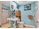 Bathroom features light blue walls and a pedestal sink at 3336 Tallywood Ct # 7084, Sarasota, FL 34237