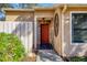 Inviting entryway with a red door and stone accents at 3336 Tallywood Ct # 7084, Sarasota, FL 34237