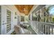 Relaxing balcony with seating area and wood ceiling at 345 Madison Dr, Sarasota, FL 34236