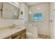 Bathroom with single vanity, shower and white subway tile at 345 Madison Dr, Sarasota, FL 34236