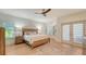 Main bedroom with wood floors, ceiling fan, and access to private balcony at 345 Madison Dr, Sarasota, FL 34236