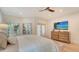 Spacious bedroom with a king-size bed and flat-screen TV at 345 Madison Dr, Sarasota, FL 34236