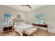 Bedroom with a queen bed, light wood floors, and a ceiling fan at 345 Madison Dr, Sarasota, FL 34236