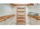 Large closet with wooden shelves and hanging rods at 345 Madison Dr, Sarasota, FL 34236