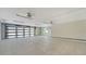 Spacious garage with tiled floor and two ceiling fans at 345 Madison Dr, Sarasota, FL 34236