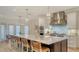 Modern kitchen with a large island, stainless steel appliances, and white cabinets at 345 Madison Dr, Sarasota, FL 34236