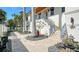 Pathway with stonework, plants, and colorful pots leading to entrance at 345 Madison Dr, Sarasota, FL 34236