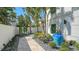 Landscaped walkway with a large blue pot, and pathway lighting at 345 Madison Dr, Sarasota, FL 34236