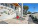 Pathway to home entrance with stonework, plants, and colorful pots at 345 Madison Dr, Sarasota, FL 34236