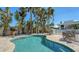 Enjoy this refreshing pool with surrounding patio furniture at 345 Madison Dr, Sarasota, FL 34236