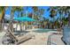 Relaxing pool area with lounge chairs and patio furniture at 345 Madison Dr, Sarasota, FL 34236