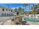 Poolside patio furniture and a refreshing kidney shaped pool at 345 Madison Dr, Sarasota, FL 34236