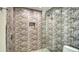 Walk-in shower with glass enclosure and patterned tile at 345 Madison Dr, Sarasota, FL 34236