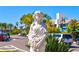 Elegant statue of a Personal holding flowers, near shops at 345 Madison Dr, Sarasota, FL 34236