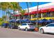 Lido Key shops and restaurants with outdoor seating and palm trees at 345 Madison Dr, Sarasota, FL 34236