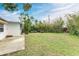 Backyard with grassy area, bamboo, and patio at 3601 Yardley N Ave, St Petersburg, FL 33713