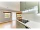 Modern kitchen with sage green cabinets and a glass cooktop at 3601 Yardley N Ave, St Petersburg, FL 33713