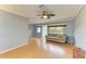 Living room with hardwood floors, ceiling fan, and French doors at 3601 Yardley N Ave, St Petersburg, FL 33713