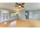 Living room with hardwood floors and access to backyard at 3601 Yardley N Ave, St Petersburg, FL 33713