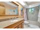 Bathroom with granite countertop and a tub at 3651 Country Place Blvd, Sarasota, FL 34233