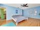 Bright bedroom with wood floors and ceiling fan at 3651 Country Place Blvd, Sarasota, FL 34233