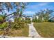 Charming house with a landscaped yard and a stone-accented facade at 3651 Country Place Blvd, Sarasota, FL 34233